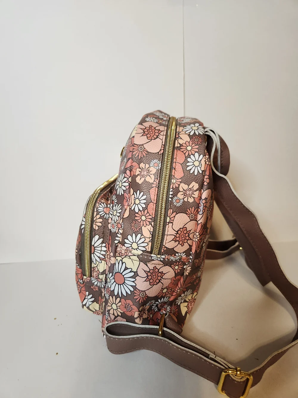 Jessica Simpson backpack with butterfly design.